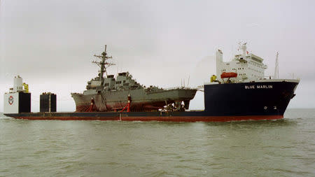 FILE PHOTO: The Norwegian heavy transport ship the Blue Marlin carries the damaged USS Cole through the Mississippi Sound toward the Litton Ingalls Shipbuilding facility in Pascagoula, Mississippi, December 13, 2000. REUTERS/David Rae Morris./File Photo