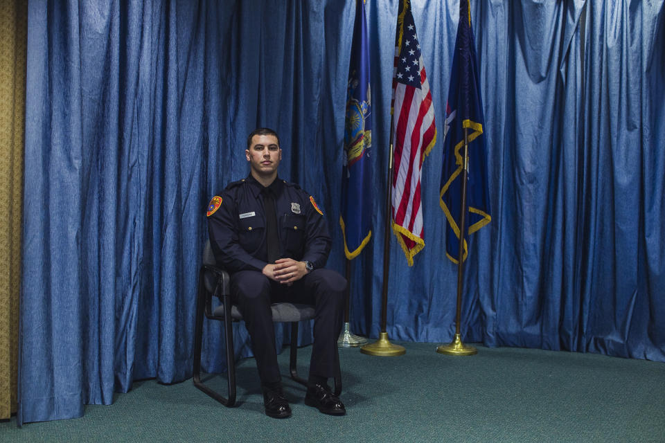 Matias Ferreira poses for a picture during his graduation from the Suffolk County Police Department Academy at the Health, Sports and Education Center in Suffolk, Long Island, New York, Friday, March 24, 2017. Ferreira, a former U.S. Marine Corps lance corporal who lost his legs below the knee when he stepped on a hidden explosive in Afghanistan in 2011, is joining a suburban New York police department. The 28-year-old graduated Friday from the Suffolk County Police Academy on Long Island following 29 weeks of training. (AP Photo/Andres Kudacki)