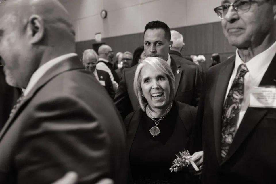 Gov. Michelle Lujan Grisham is escorted through the crowd after her State of the State address at the Roundhouse in 2023.