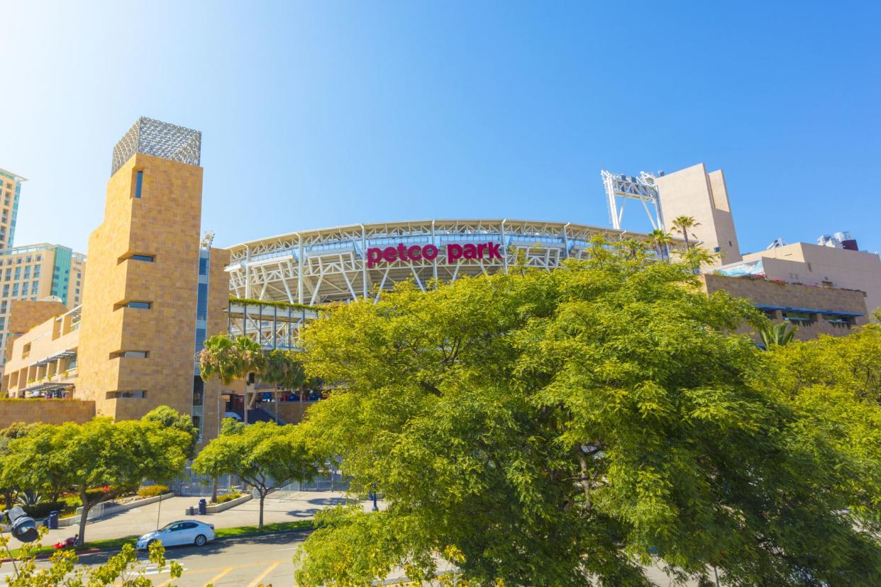 Exterior of front of Petco Park, San Diego, home of the San Diego Padres with parking lot during a sunny day