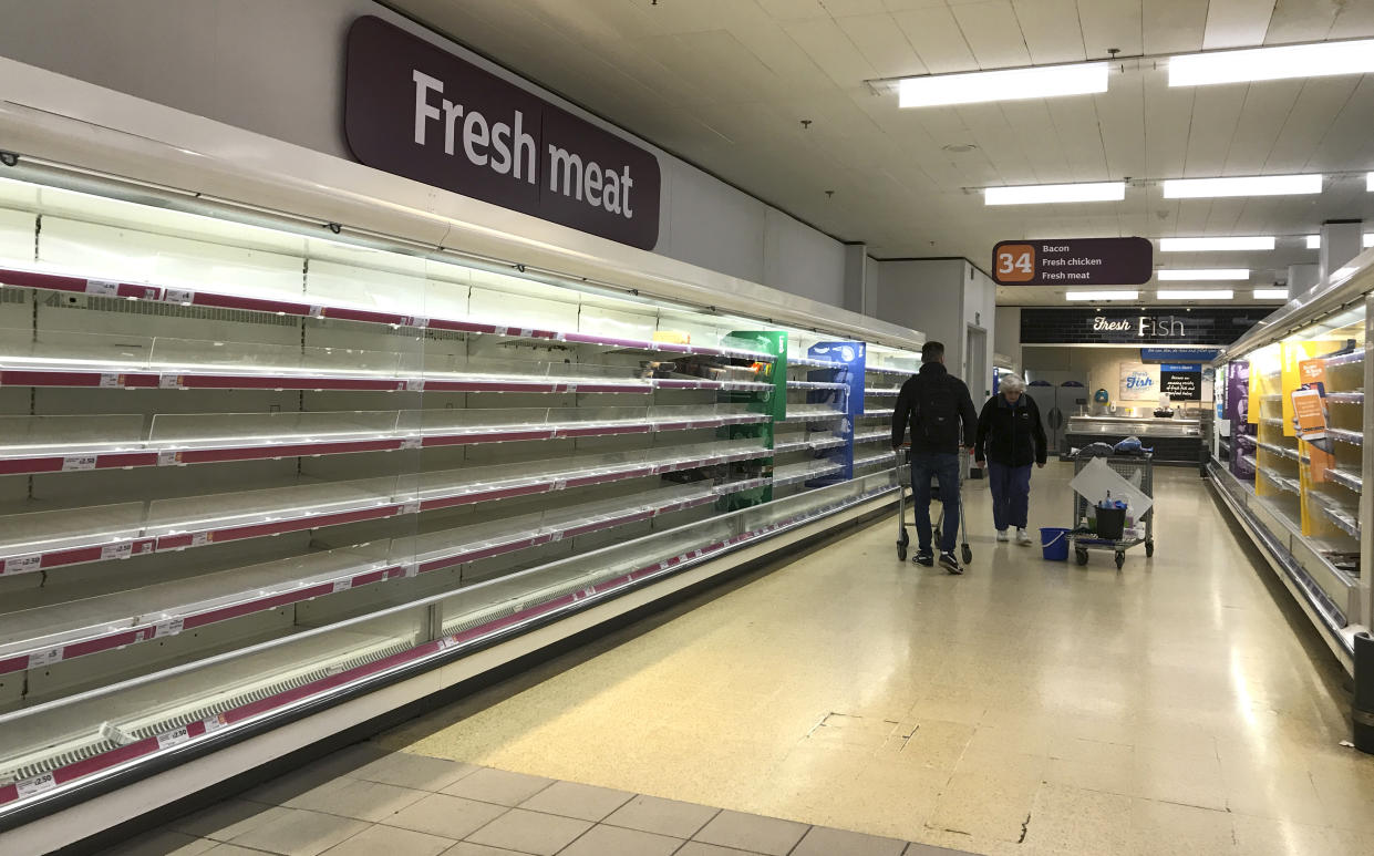 Empty shelves in a supermarket in London, Thursday, March 19, 2020. For some people the new coronavirus causes mild or moderate symptoms, such as fever and cough, but for some, especially older adults and people with existing health problems, it can cause more severe illness, including pneumonia. (AP Photo/Kirsty Wigglesworth)