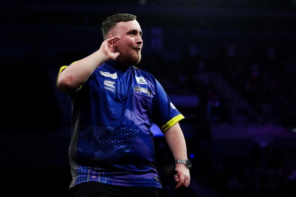 Warrington Guardian: Littler gestures to the Liverpool crowd during his match against Nathan Aspinall
