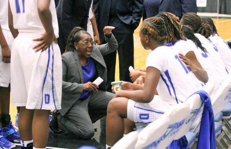 Dillard coach Marcia Pinder gives instructions to her team during a timeout against Jacksonville Paxon during the girls’ 5A basketball championship at The Lakeland Center on Saturday, Feb. 21, 2015.