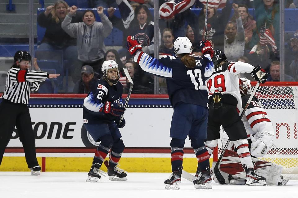 United States' Amanda Kessel (28) celebrates her goal with teammate Kelly Pannek (12) during the second period of a rivalry series women's hockey game against Canada in Hartford, Conn., Saturday, Dec. 14, 2019. (AP Photo/Michael Dwyer)