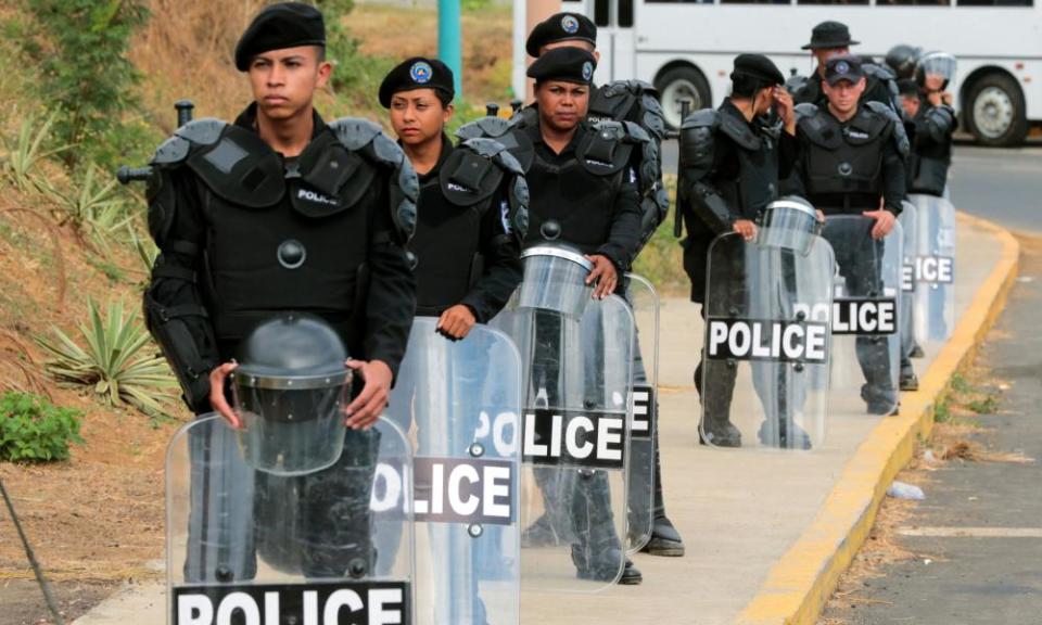 Riot police officers stand guard in Managua before a protest against Nicaraguan President Daniel Ortega’s government.