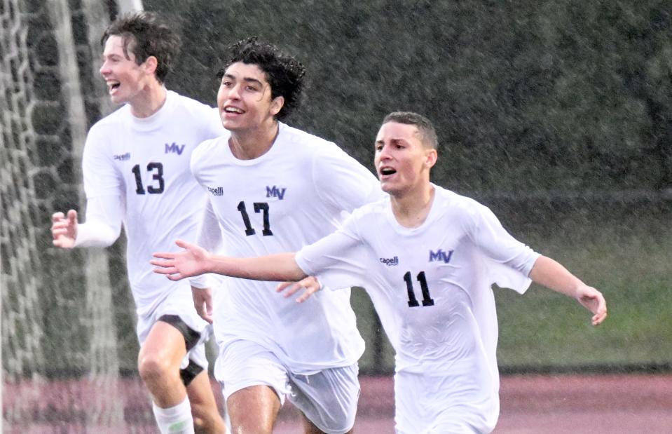 SANDWICH  10/04/22 Arthur Da Silva (11) celebrates with  Martha's Vineyard teammates Joshua Pereira (17)  and Porter Moehnke after scoring the fourth goal in a 4-1 win over Sandwich.