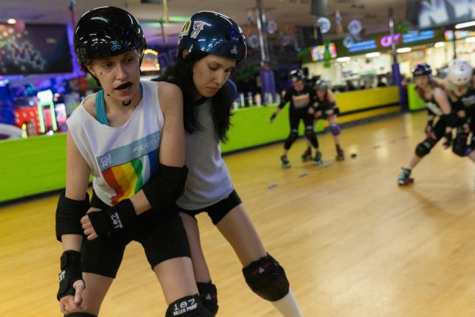 Two members of the Long Island Roller Rebels collide with each other during their practice at United Skates of America on March 19. 2024. AP