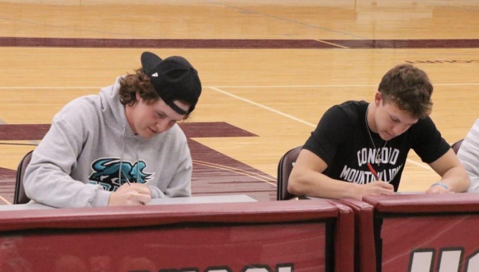 Newark seniors Ty Pangborn (left) and Noah Dagois signed their national letters of intent on their college decisions before a large crowd in Jimmy Allen Gymnasium.