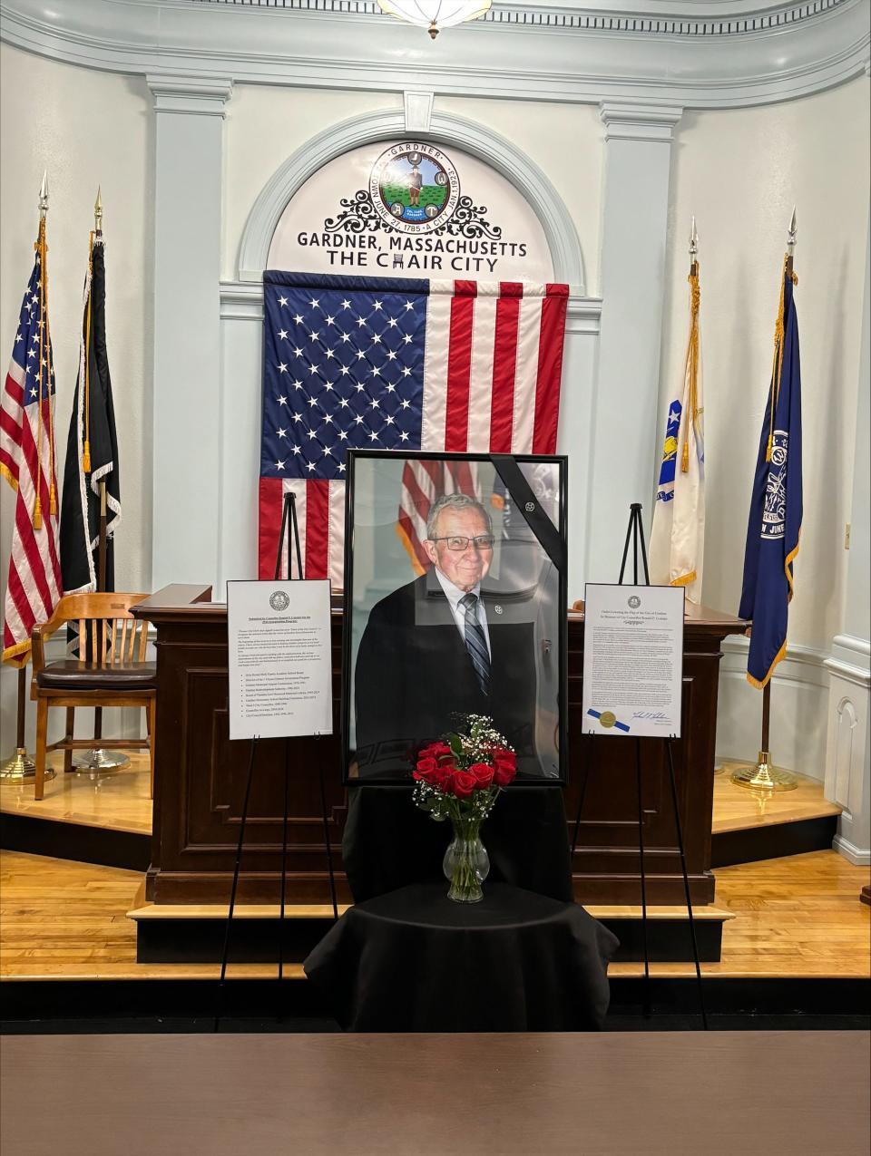 A portrait of City Councilor Ronald Cormier is displayed in the City Council Chambers at City Hall in Gardner. Cormier, the longest-serving councilor in the city's history, died on Sunday at the age of 81.