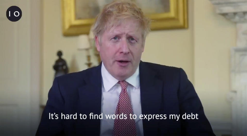 A grab done from the Twitter page of Britain's Prime Minister Boris Johnson, broadcast with text overlay, in which he hails the staff in the National Health Service (NHS) for saving his life, filmed at 10 Downing Street, London, Sunday April 12, 2020. Johnson was discharged earlier Sunday from a London hospital where he was treated in intensive care for the new COVID-19 coronavirus. (Twitter Boris Johnson/Downing Street via AP)