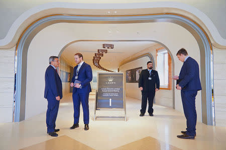 Security staff and officials stand at the entrance to the annual shareholder meeting of Australia's top casino operator Crown Resorts in Perth, Western Australia, October 20, 2016. REUTERS/Aaron Bunch