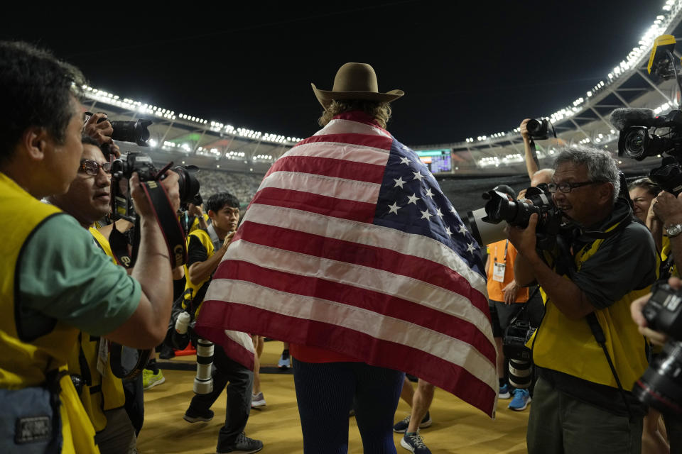 Ryan Crouser, of the United States, celebrates after winning gold in Men's shot put final during the World Athletics Championships in Budapest, Hungary, Saturday, Aug. 19, 2023. (AP Photo/Ashley Landis)