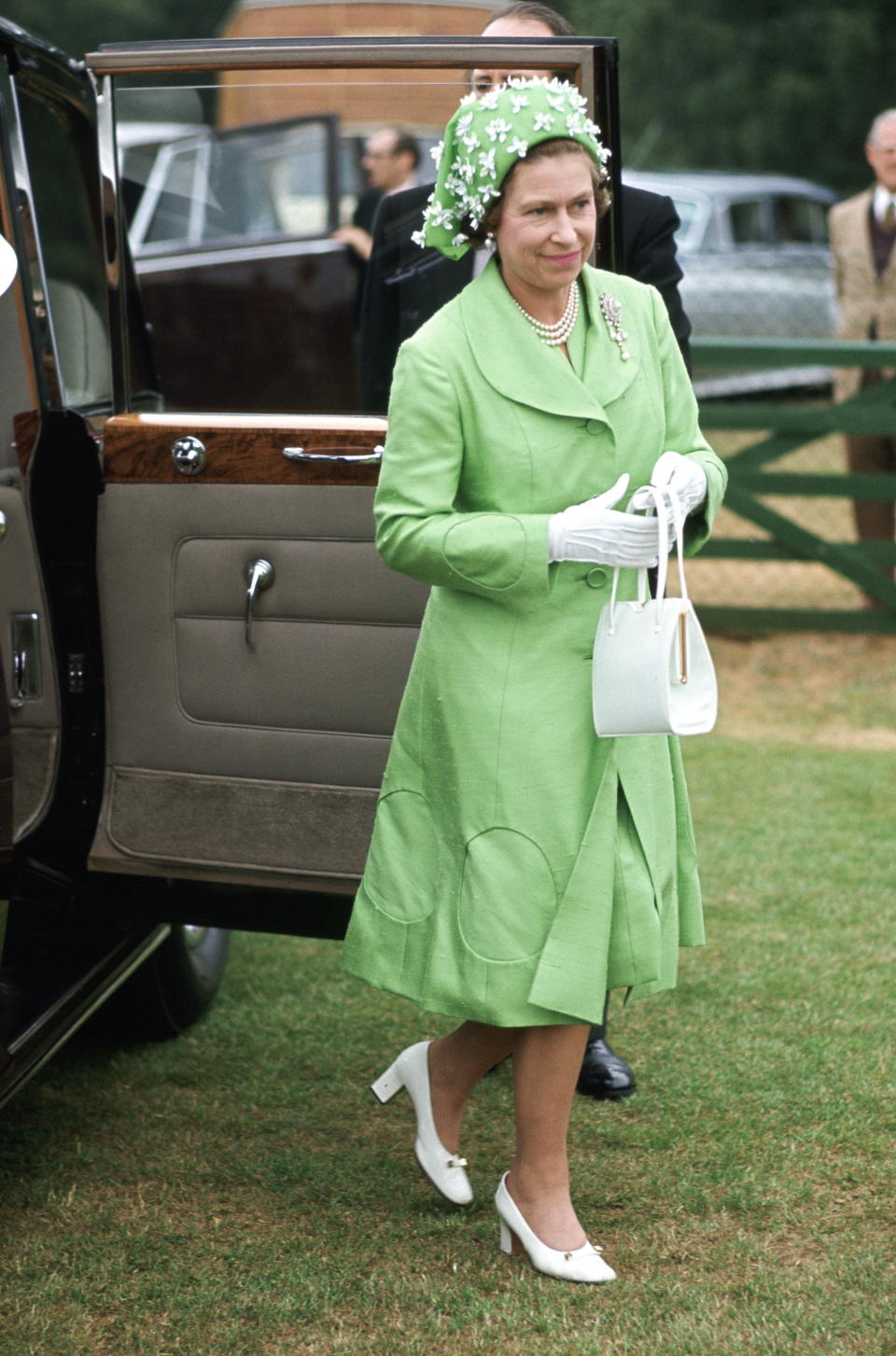 Queen Elizabeth Ll Arriving Polo At Smiths Lawn Windsor After Ascot Races Wearing A Silk Mint Green Coat And Matching Dress With A Green And White Hat Designed By Milliner Simone Mirman. (Photo by Tim Graham/Getty Images)