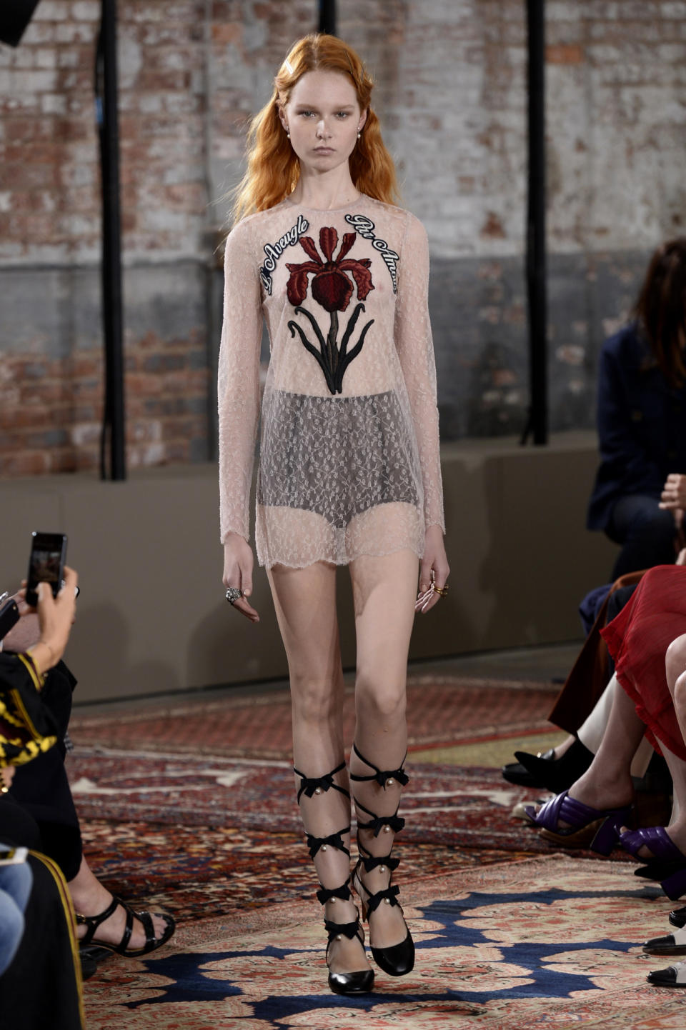 A sheer lace dress from the Gucci Resort 2016 collection.