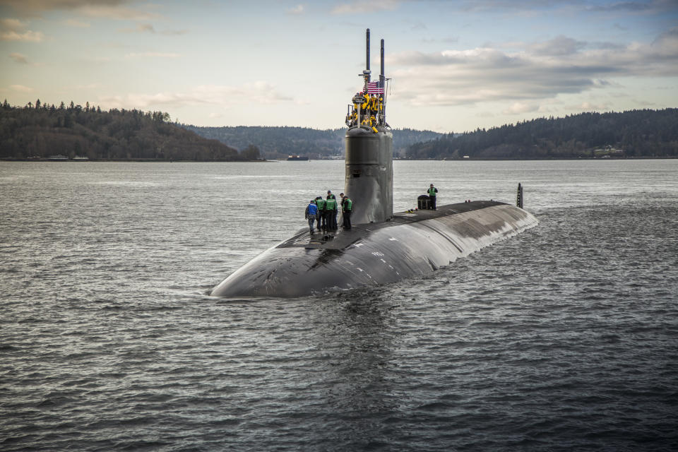 FILE - In this Dec. 15, 2016, photo provided by the U.S. Navy, the Seawolf-class fast-attack submarine USS Connecticut (SSN 22) departs Puget Sound Naval Shipyard in Bremerton, Wash., for sea trials following a maintenance availability. The vessel that went missing Sunday, June 18, 2023, in the North Atlantic while exploring the Titanic is not a submarine, it's a submersible. The National Oceanic and Atmospheric Administration says a submarine has enough power to leave port and come back to port under its own power while a submersible is not autonomous. (Thiep Van Nguyen II/U.S. Navy via AP, File)