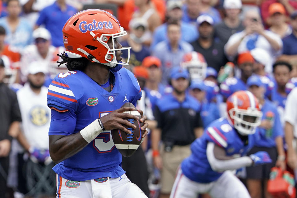 Florida quarterback Emory Jones looks for a receiver during the first half of an NCAA college football game against Alabama, Saturday, Sept. 18, 2021, in Gainesville, Fla. (AP Photo/John Raoux)