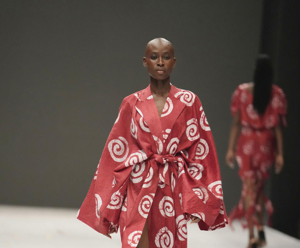 A model wears a creation by Cynthia Abila during the Lagos Fashion Week in Lagos, Nigeria, Thursday, Oct. 26, 2023. Africa's fashion industry is rapidly growing to meet local and international demands but a lack of adequate investment still limits its full potential, UNESCO said Thursday in its new report released at this year's Lagos Fashion Week show. (AP Photo/Sunday Alamba)