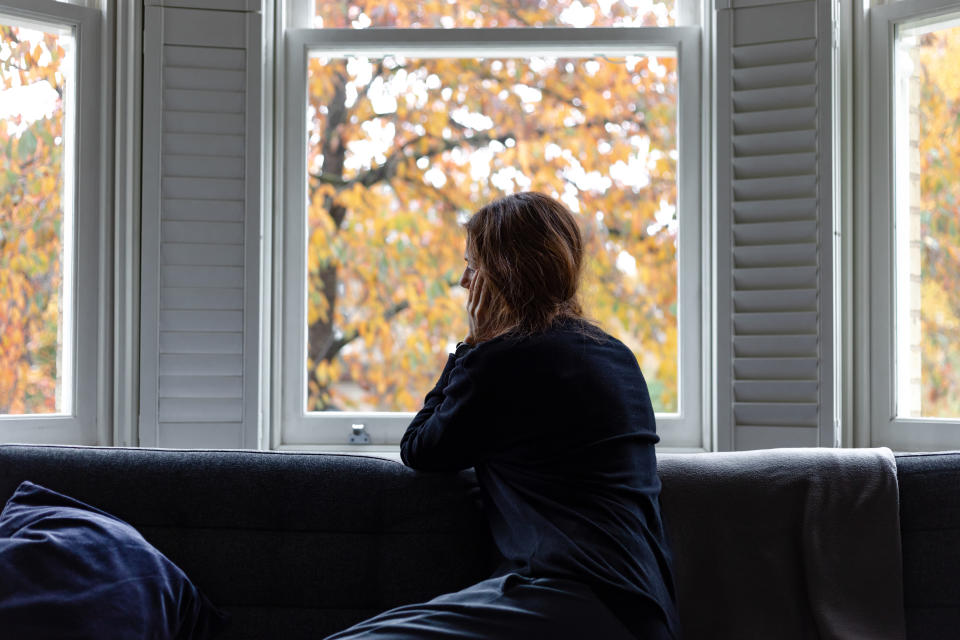 A woman looking out the window