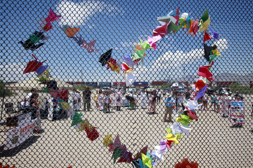 Paper doves in the shape of a heart are seen at the border fence in Ciudad Juarez, Mexico.