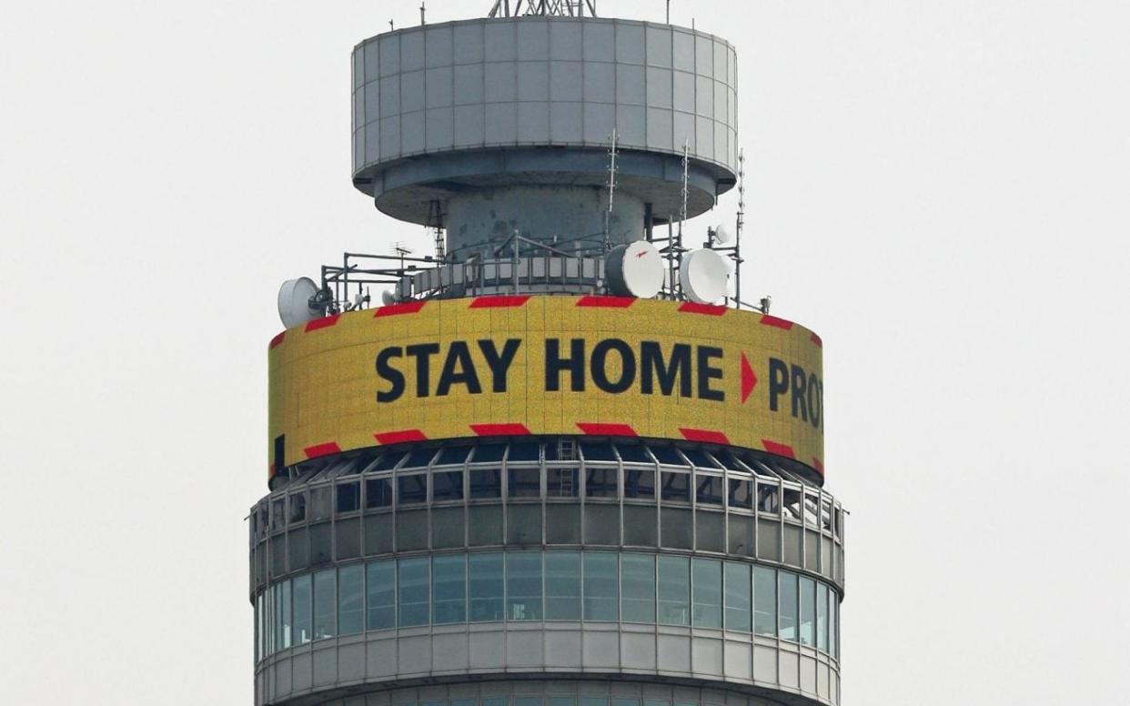 The 'Stay Home' slogan, seen displayed on the top of the BT Tower in London - PA