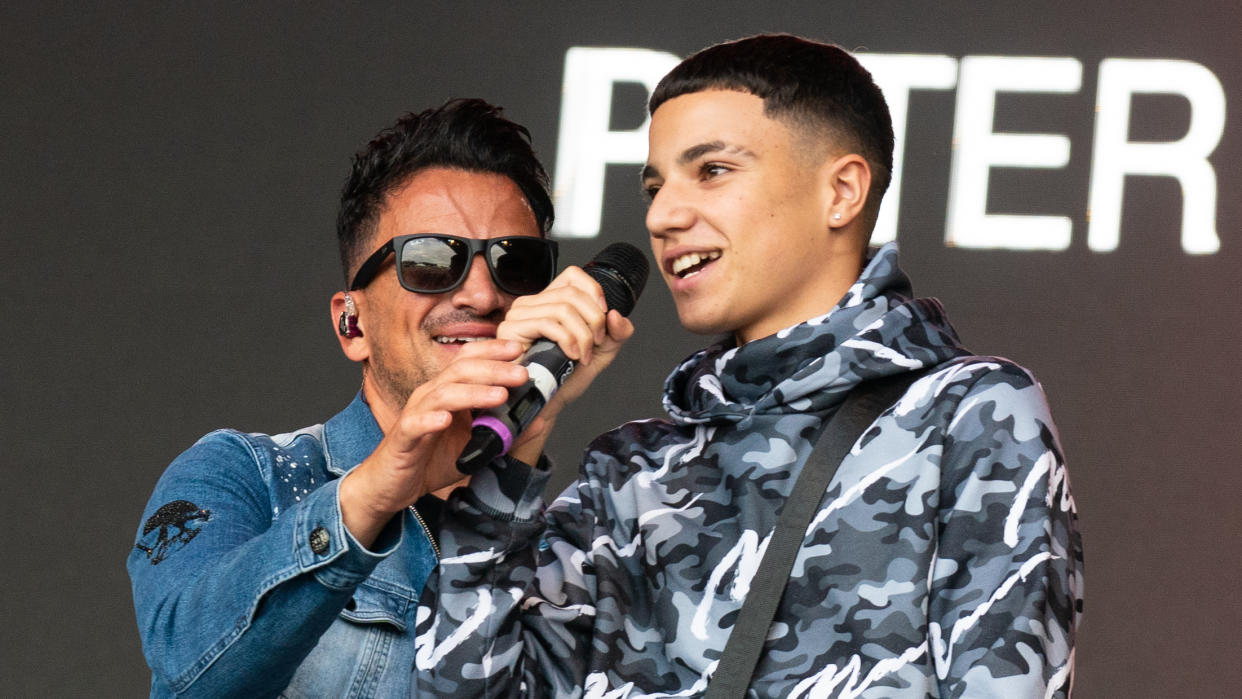 Junior Andre and dad Peter Andre on stage