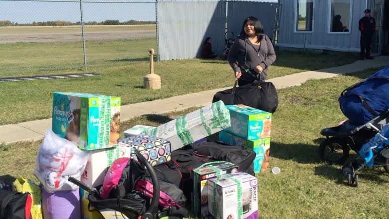 'Everybody's anxious': 1,800 wildfire evacuees wait for flights home from Winnipeg and Brandon