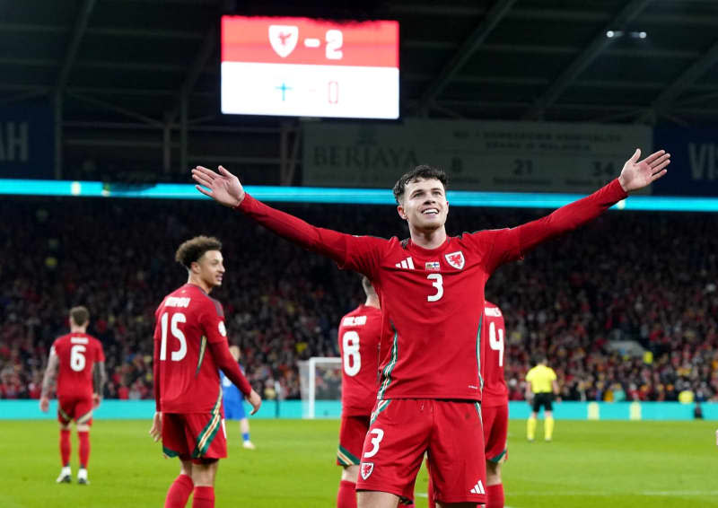 Wales' Neco Williams celebrates scoring his side's second goal during the UEFA Euro 2024 Qualifying play-off soccer match between Wales and Finland at the Cardiff City Stadium. Nick Potts/PA Wire/dpa