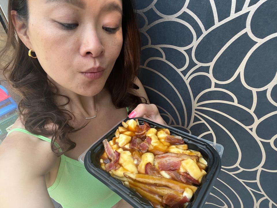 Selfie of the writer with poutine from Wendy's