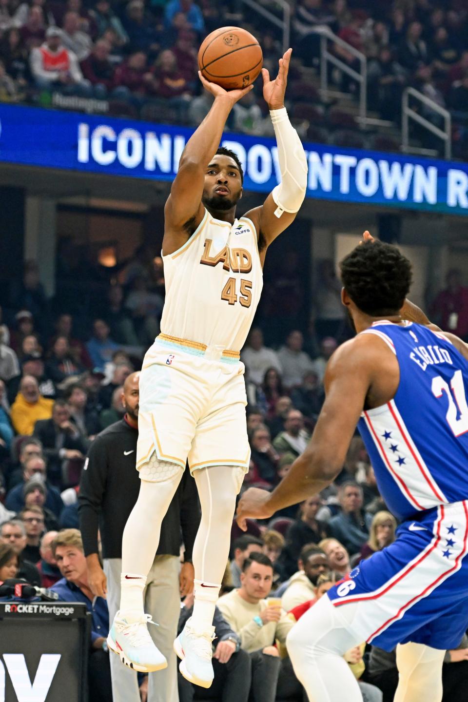 Cleveland Cavaliers guard Donovan Mitchell shoots a three-point basket during the first half of an NBA basketball game against the Philadelphia 76ers, Wednesday, Nov. 30, 2022, in Cleveland. (AP Photo/Nick Cammett)