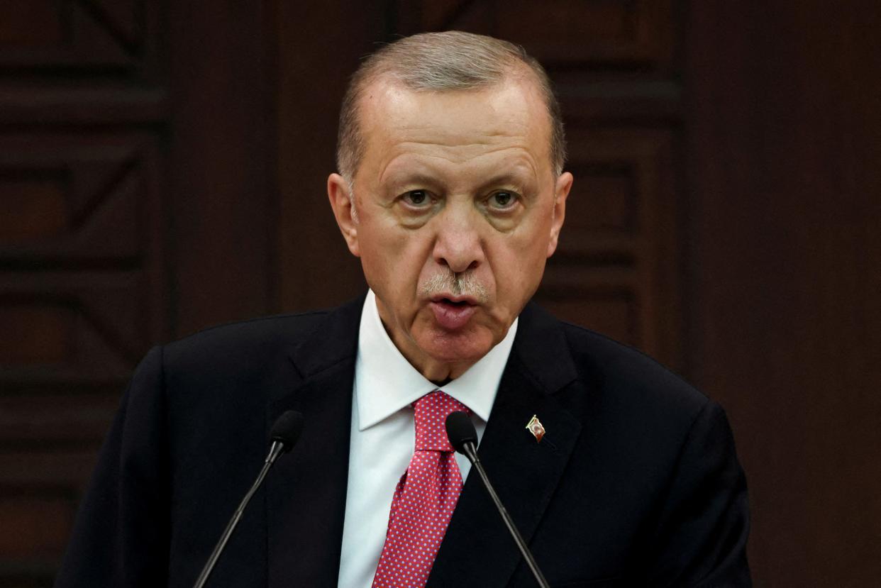 Turkish President Tayyip Erdogan announces new cabinet during a press conference in Ankara, 3 June (REUTERS)