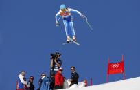 Italy's Christof Innerhofer goes airborne during the downhill run of the men's alpine skiing super combined event at the 2014 Sochi Winter Olympics at the Rosa Khutor Alpine Center February 14, 2014. REUTERS/Stefano Rellandini