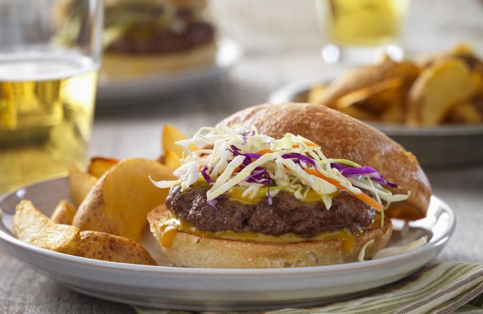 <p>OK, so burgers might not immediately come to mind when you think about sandwiches. But it’s summer, and no <a href="https://www.thedailymeal.com/entertain/summer-bucket-list-gallery?referrer=yahoo&category=beauty_food&include_utm=1&utm_medium=referral&utm_source=yahoo&utm_campaign=feed" rel="nofollow noopener" target="_blank" data-ylk="slk:foodie’s summer bucket list;elm:context_link;itc:0;sec:content-canvas" class="link ">foodie’s summer bucket list</a> is complete without at least one burger cookout. Bring a little pulled pork inspo to the ground beef burgers by coating them in a homemade barbecue sauce and topping the whole thing with <a href="https://www.thedailymeal.com/cook/how-to-make-coleslaw?referrer=yahoo&category=beauty_food&include_utm=1&utm_medium=referral&utm_source=yahoo&utm_campaign=feed" rel="nofollow noopener" target="_blank" data-ylk="slk:coleslaw;elm:context_link;itc:0;sec:content-canvas" class="link ">coleslaw</a>.</p> <p><a href="https://www.thedailymeal.com/carolina-barbecue-burgers?referrer=yahoo&category=beauty_food&include_utm=1&utm_medium=referral&utm_source=yahoo&utm_campaign=feed" rel="nofollow noopener" target="_blank" data-ylk="slk:For the Carolina Barbecue Burgers recipe, click here.;elm:context_link;itc:0;sec:content-canvas" class="link ">For the Carolina Barbecue Burgers recipe, click here.</a></p>