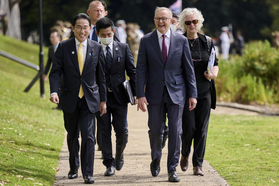 Japan's Prime Minister Fumio Kishida, front left, walks with Australian Prime Minister Anthony Albanese, front right, during a visit to Kings Park in Perth, Australia, Saturday, Oct. 22, 2022. Kishida visit is to bolster military and energy cooperation between Australia and Japan amid their shared concerns about China. (Stefan Gosatti/Pool Photo via AP)