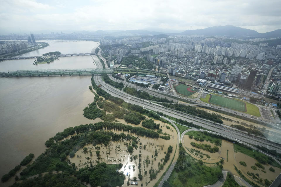 A part of a main road along the Han River is flooded due to heavy rain in Seoul, South Korea, Wednesday, Aug. 10, 2022. Cleanup and recovery efforts gained pace in South Korea's greater capital region Wednesday as skies cleared after two days of record-breaking rainfall that unleashed flash floods, damaged thousands of buildings and roads and killed multiple people. (AP Photo/Ahn Young-joon)