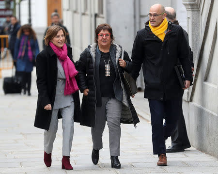 Catalan politicians (L-R) Carme Forcadell, Dolors Bassa and Raul Romeva arrive together to the Supreme Court after being summoned and facing investigation for their part in Catalonia's bid for independence in Madrid, Spain, March 23, 2018. REUTERS/Susana Vera