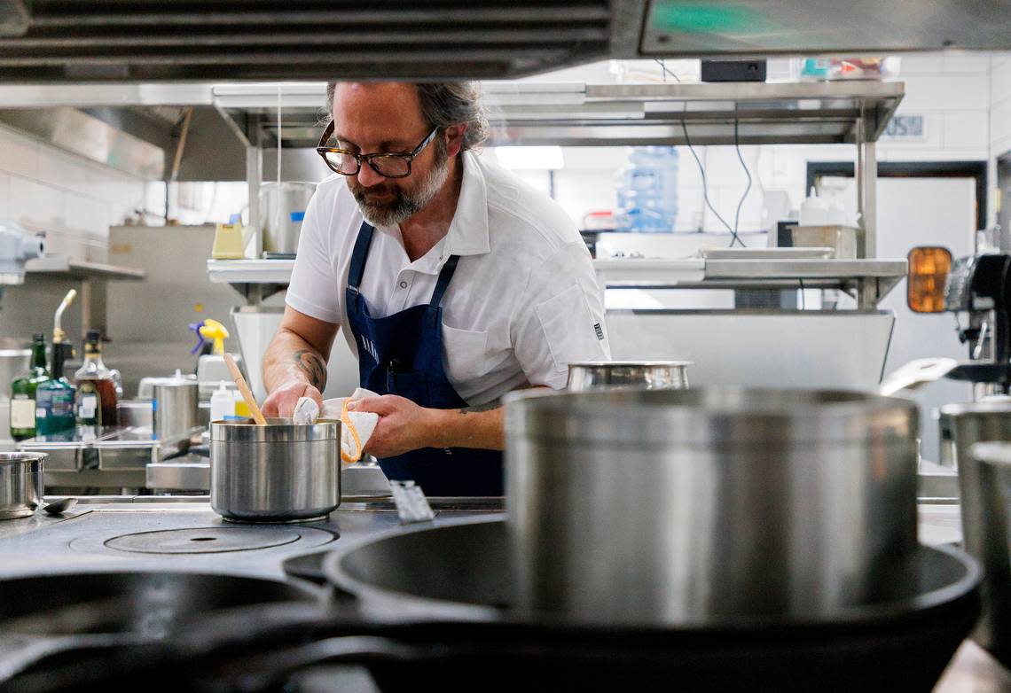 Nate Garyantes, co-chef and co-owner of Nanas, prepares a dish in the restaurant’s kitchen on Wednesday, Nov. 22, 2023, in Durham, N.C.