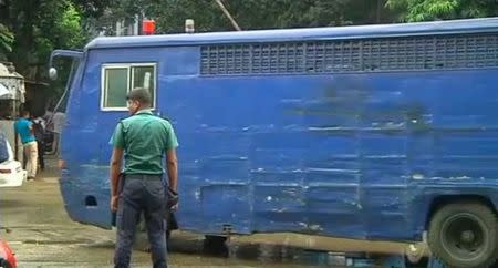 A prison van is seen along a street as police stormed the Holey Artisan restaurant after gunmen attacked it and took hostages early on Saturday in Dhaka, Bangladesh in this still frame taken from video July 2, 2016. REUTERS/ REUTERS TV