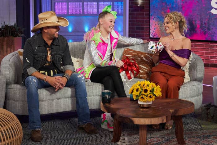 JoJo and Candace sitting on a couch during a talk show interview