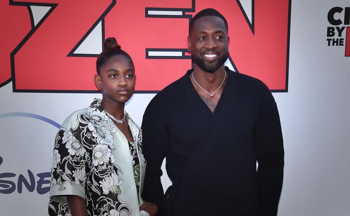 Former professional basketball player Dwyane Wade and his daughter, Zaya Wade, arrive for the "Cheaper by the Dozen" Disney premiere in 2022.