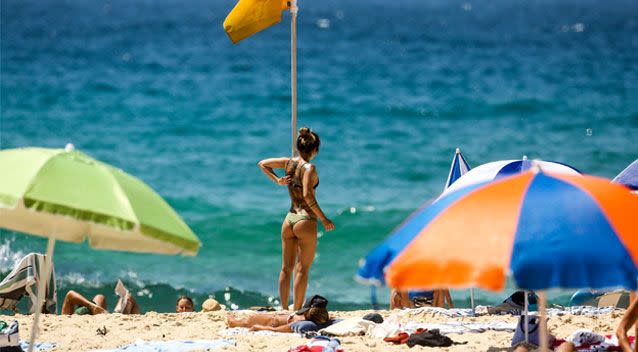 Hundreds of parasols lined Sydney's beaches as visitors paid attention to the ongoing health warnings. Source: AAP