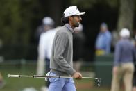 Akshay Bhatia walks on the putting green during a practice round in preparation for the Masters golf tournament at Augusta National Golf Club Tuesday, April 9, 2024, in Augusta, Ga. (AP Photo/Charlie Riedel)
