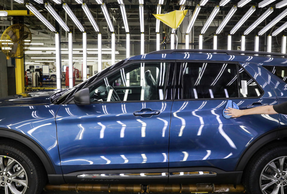 FILE - In this June 24, 2019, file photo a Ford employee works on a Ford Explorer line at Ford's Chicago Assembly Plant in Chicago's Hegewisch neighborhood. Ford Motor Co. reports earning on Wednesday, July 24, 2019. (AP Photo/Amr Alfiky, File)
