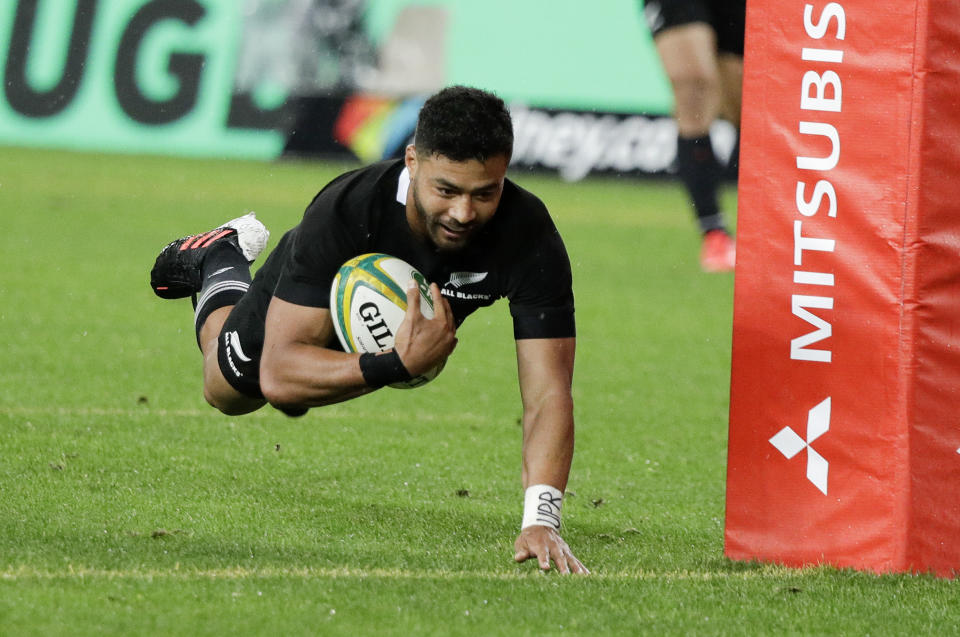 New Zealand's Richie Mo'unga dives across the line to score his team's third try during the Bledisloe rugby test between the All Blacks and the Wallabies at Stadium Australia, Sydney, Australia, Saturday, Oct. 31, 2020. (AP Photo/Rick Rycroft)