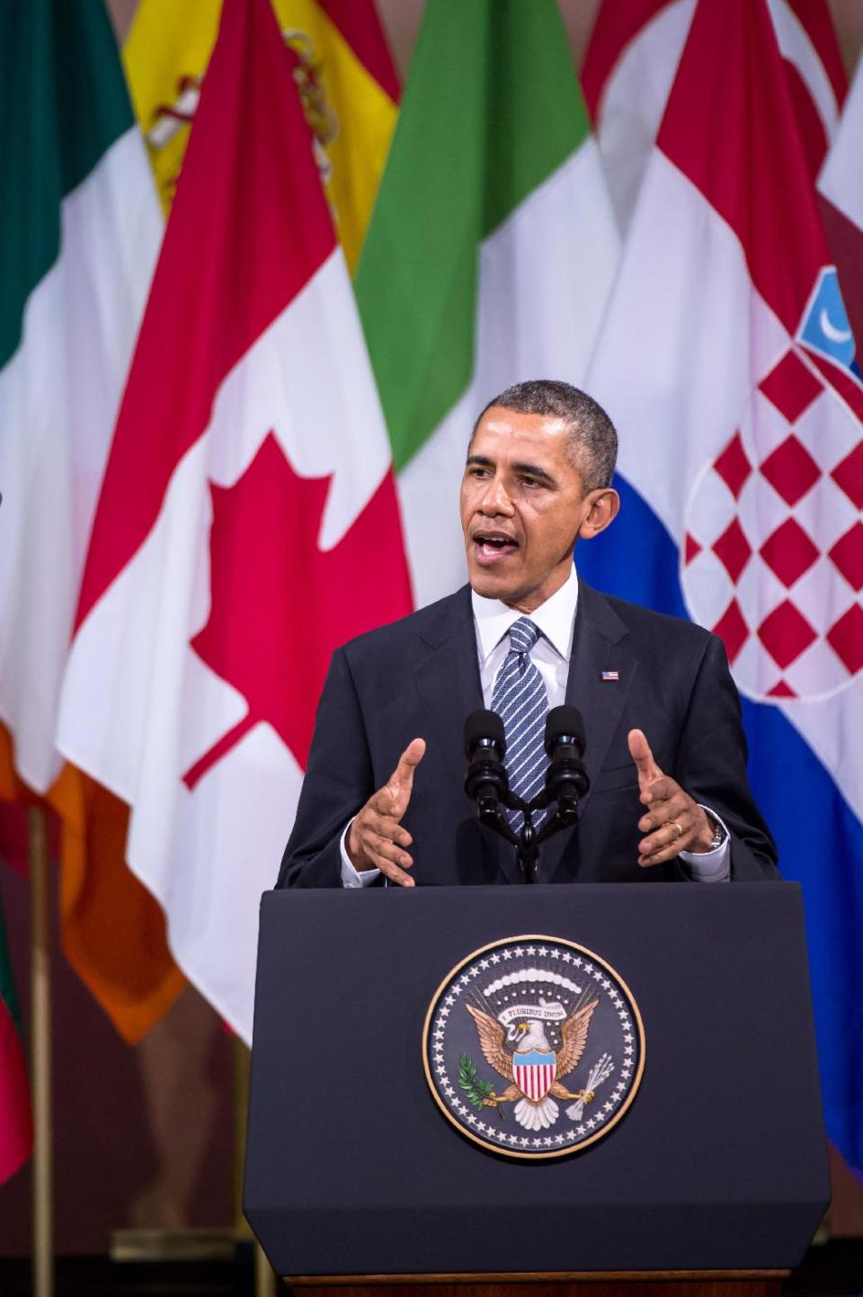 U.S. President Barack Obama talks at The Centre for Fine Arts in Brussels on Wednesday, March 26, 2014. President Barack Obama appealed to Europeans on Wednesday to retrench behind the war-won ideals of freedom and human dignity, declaring that those advocating those values will ultimately triumph in Ukraine. (AP Photo/Geert Vanden Wijngaert)