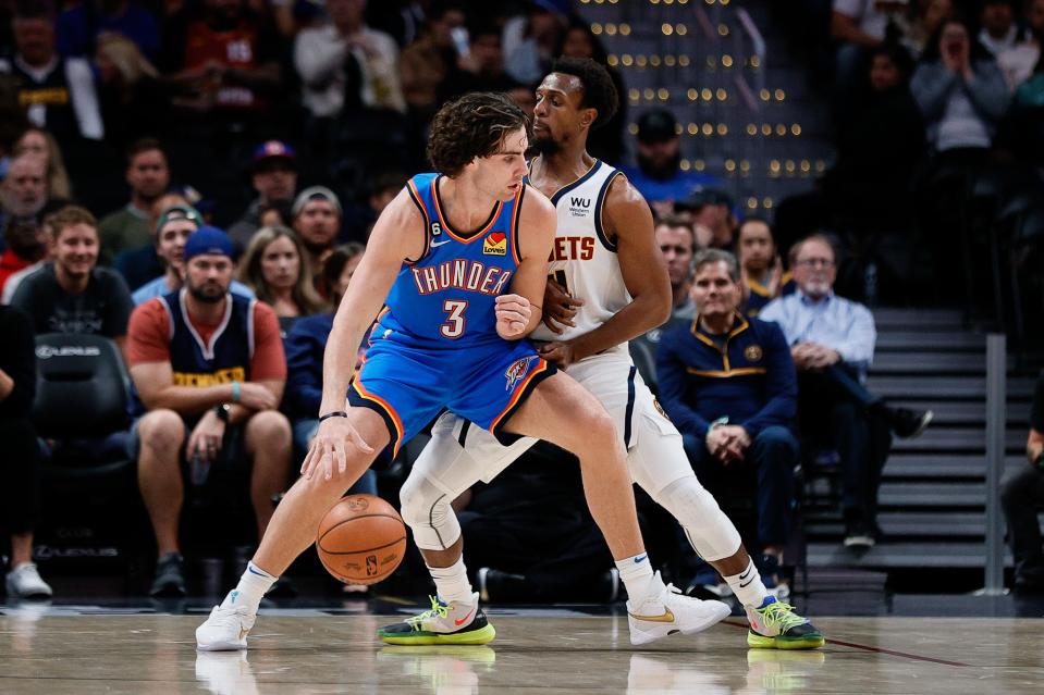 Oklahoma City Thunder guard Josh Giddey (3) controls the ball while being defended by Denver's Ish Smith during an Oct. 3 exhibition game.