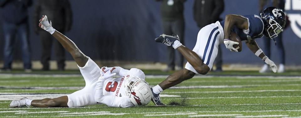 Fresno State defensive back Al’zillion Hamilton (3) tackles Utah State wide receiver Jalen Royals during the second half of an NCAA college football game Friday, Oct. 13, 2023, in Logan, Utah. | Eli Lucero/The Herald Journal via AP
