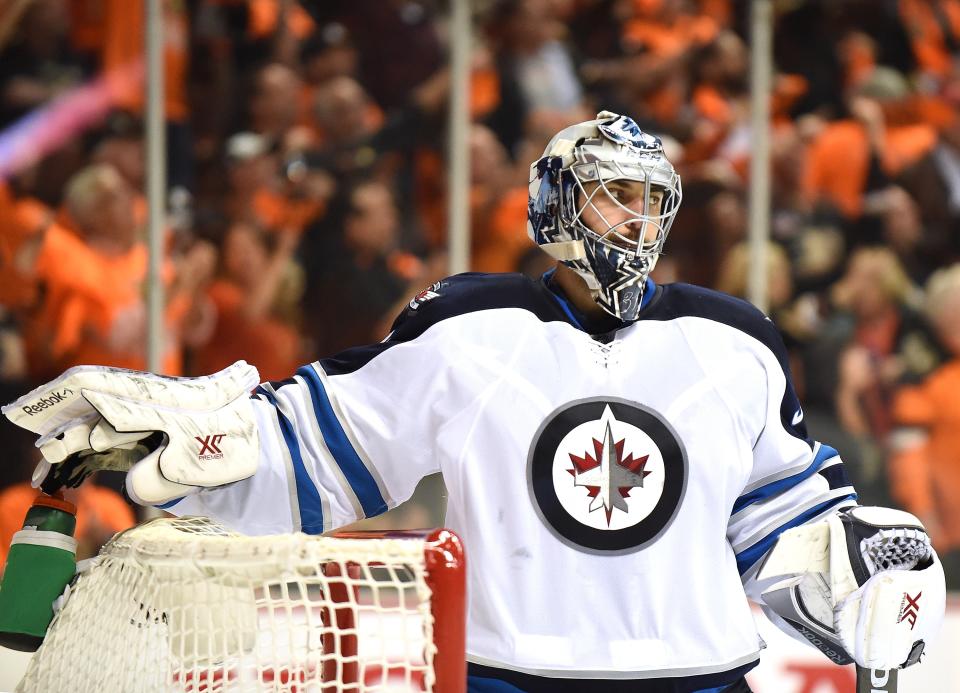 ANAHEIM, CA - APRIL 16:  Ondrej Pavelec #31 of the Winnipeg Jets reacts after the announcement of a Corey Perry #10 of the Anaheim Ducks, using video replay, resulting in a 3-2 Ducks lead during the third period in Game One of the Western Conference Quarterfinals during the 2015 NHL Stanley Cup Playoffs at Honda Center on April 16, 2015 in Anaheim, California.  (Photo by Harry How/Getty Images)