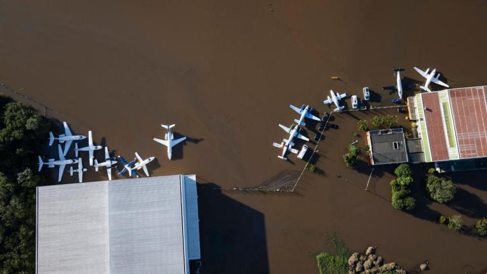 Aerial view showing planes on a flooded runway at Salgado Filho International Airport in Porto Alegre, Brazil, on 06 May 2024. Floods caused by heavy rains in southern Brazil have caused at least 86 deaths and left 134 missing, according to the latest figures released 06 May by regional authorities.