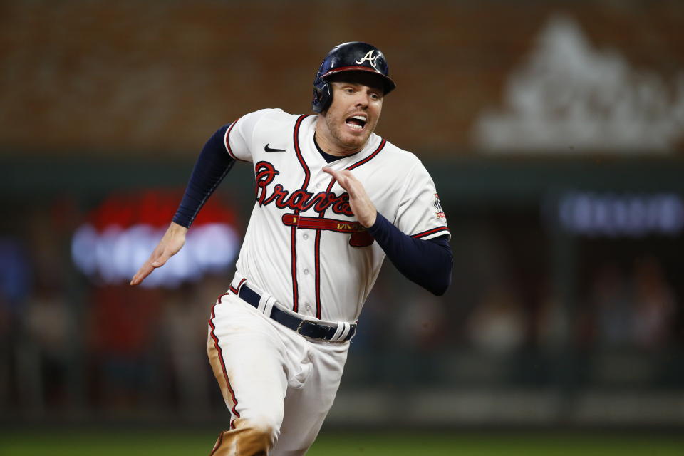 ATLANTA, GEORGIA - OCTOBER 12: Freddie Freeman #5 of the Atlanta Braves runs to third during the sixth inning against the Milwaukee Brewers in game four of the National League Division Series at Truist Park on October 12, 2021 in Atlanta, Georgia. (Photo by Michael Zarrilli/Getty Images)