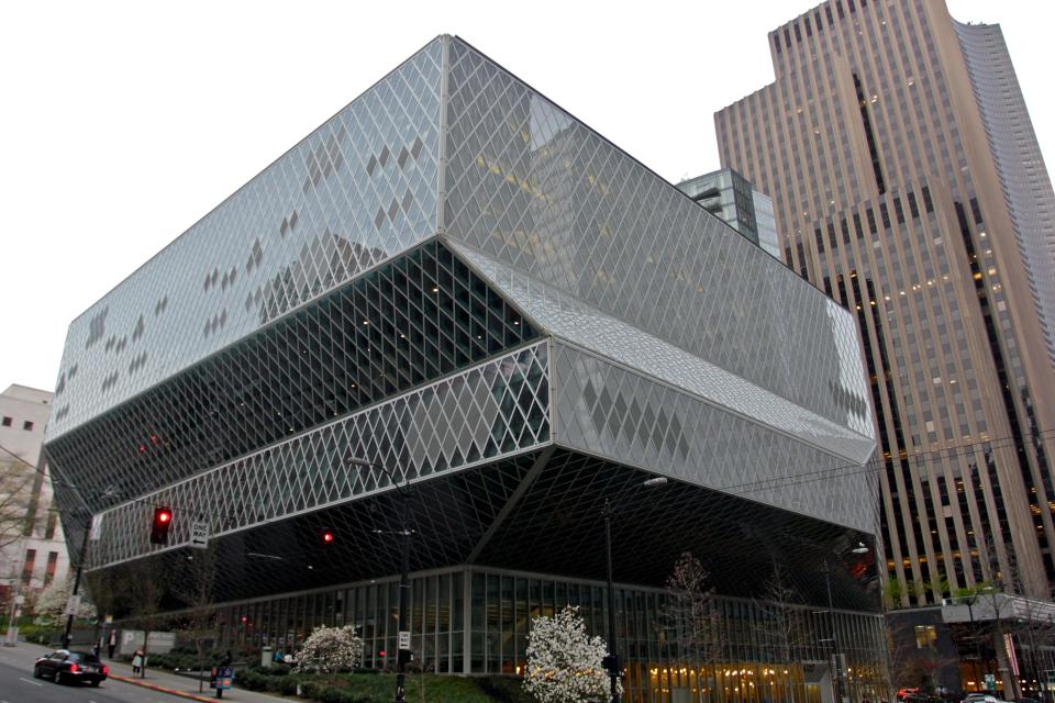 This image taken April 3, 2013 shows the exterior of the Seattle Central Library in downtown Seattle. The $165 million building’s unusual design and decoration attracts visitors from all over the world. (AP Photo/Manuel Valdes)